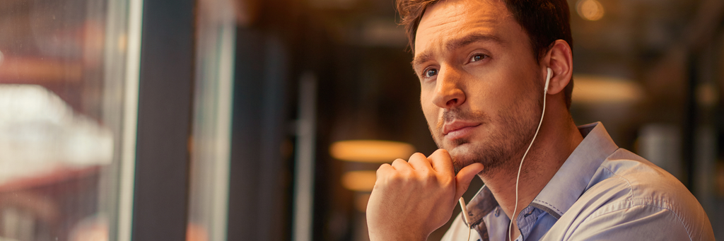 Person reflecting and taking notes after receiving feedback